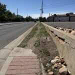 Photo of current Ralston Road sidewalk in the project area, which is damaged at the corner and turns into dirt.