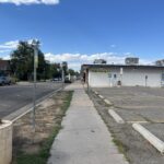 Image of Yukon Street looking north, depicting a sidewalk, parking lot, and an underutilized planting strip.